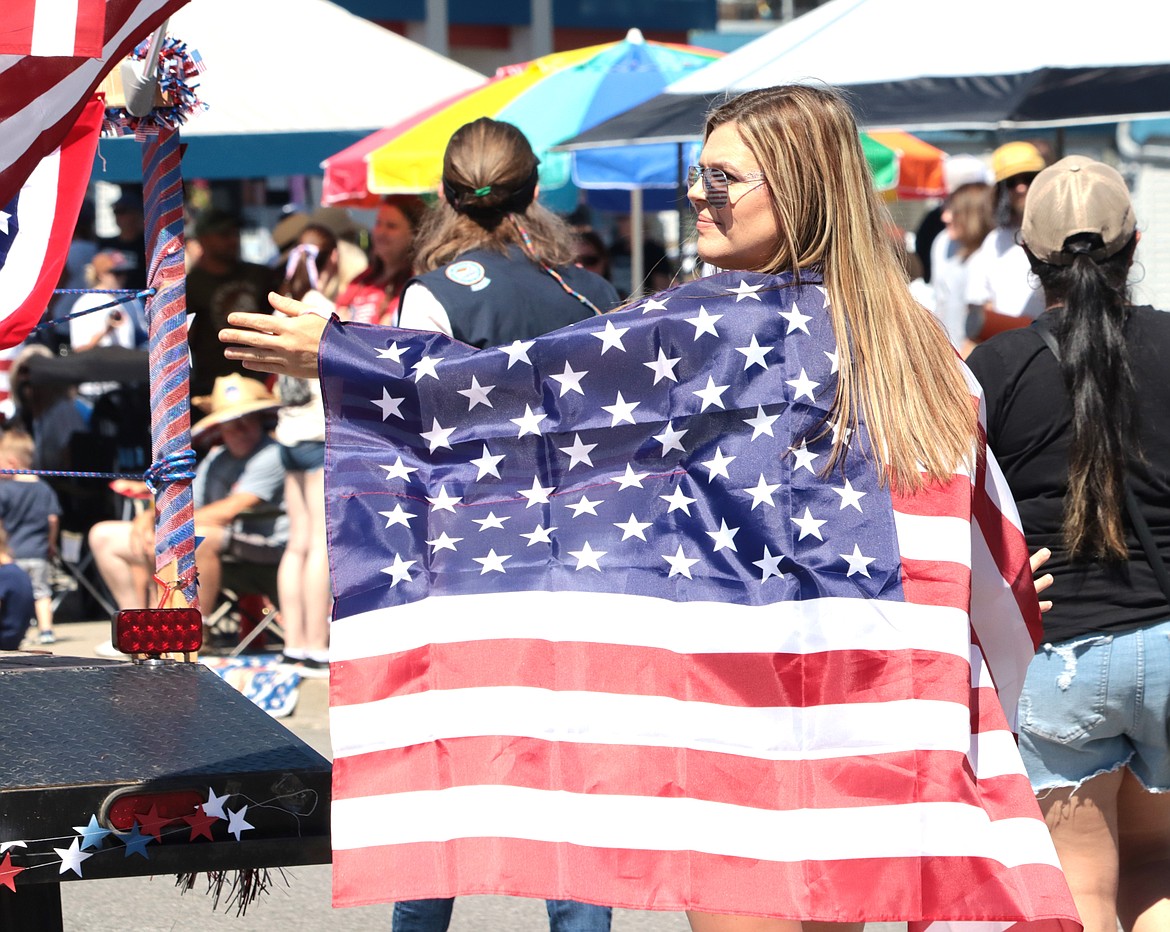 Leigha Seierup wears a patriotic cape during the Fourth of July parade in Coeur d'Alene.