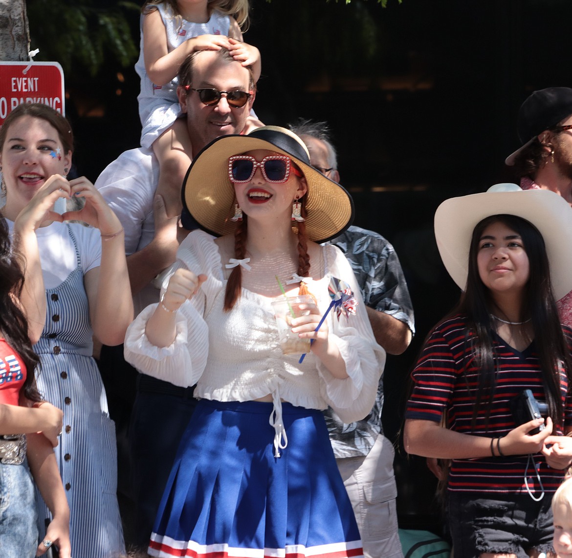 People watch the Fourth of July parade.