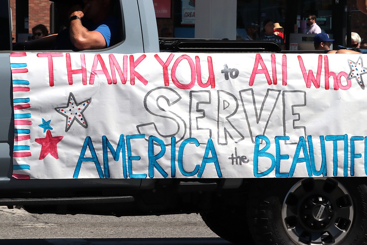 A poster sends out a message during the parade.