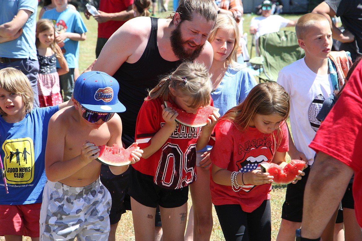 Competitors in the 9-year-old division chomp away.