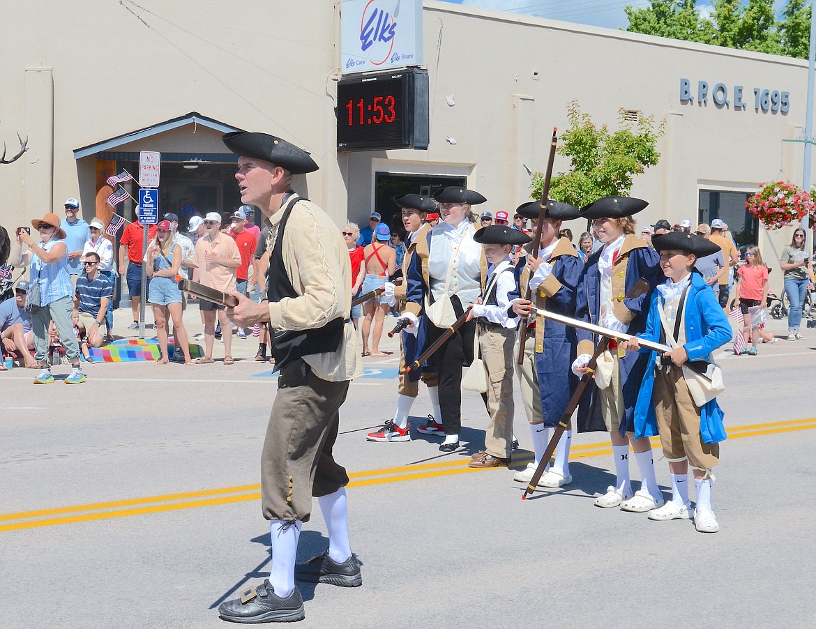 THE POLSON MINUTEMEN prepare for an initial skirmish with the Red Coats prior to Polson's parade on July 4. (Kristi Niemeyer/Leader)