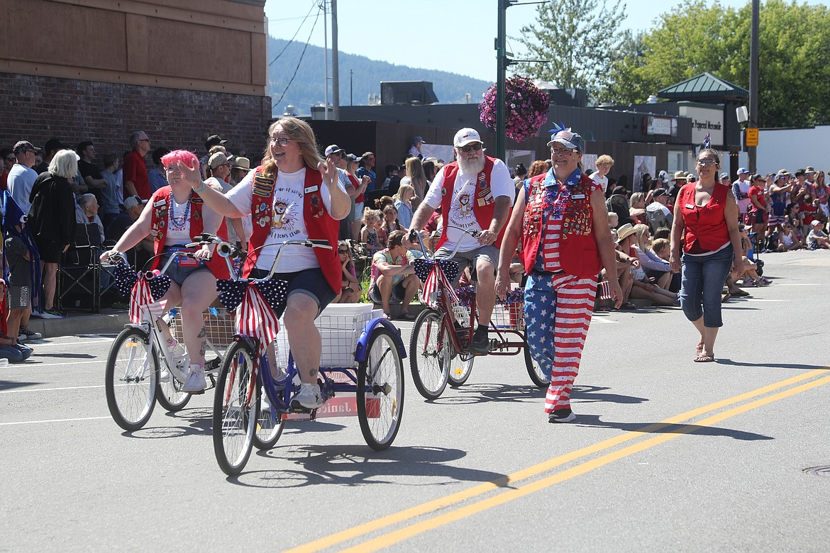 Sandpoint Lions members ride down First Avenue during the Grand Parade.