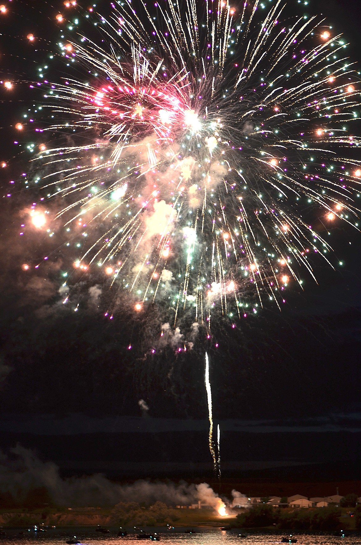 FIREWORKS decorated the night sky above the Flathead River last Wednesday, in a colorful display sponsored by the Polson Chamber of Commerce. (Kristi Niemeyer/Leader)