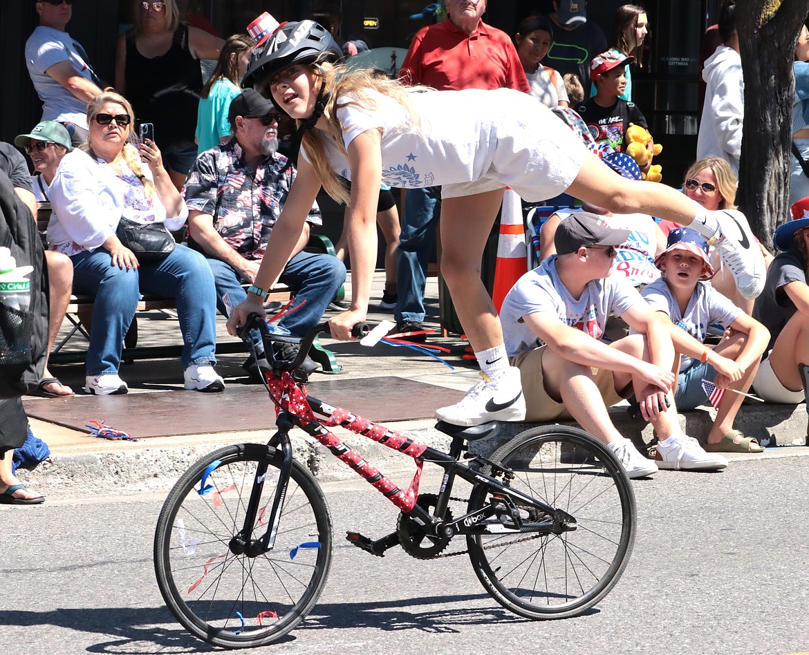 Riley Krebs rides her bike in style with the BMX parade entry.