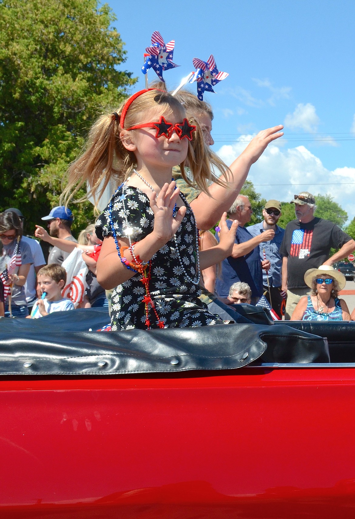 SPARKLE PLENTY brightened the Polson parade route in her bright red convertible. (Kristi Niemeyer/Leader)