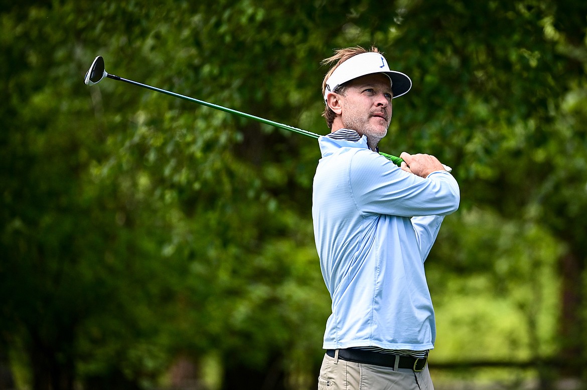 Andrew Medley watches his tee shot on the 10th hole of the South Course during the Earl Hunt Memorial 4th of July Tournament at Whitefish Lake Golf Club on Friday, July 5. (Casey Kreider/Daily Inter Lake)