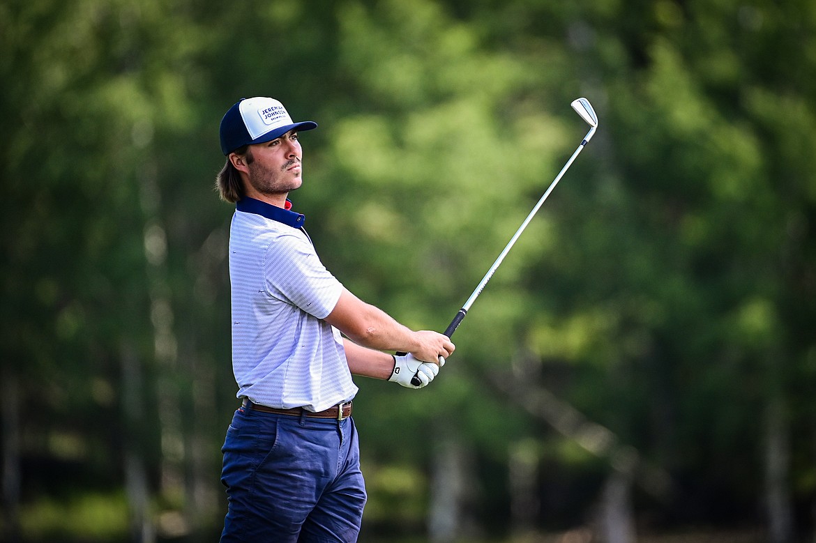 Christian Clark watches his tee shot on the 8th hole of the South Course during the Earl Hunt Memorial 4th of July Tournament at Whitefish Lake Golf Club on Friday, July 5. (Casey Kreider/Daily Inter Lake)