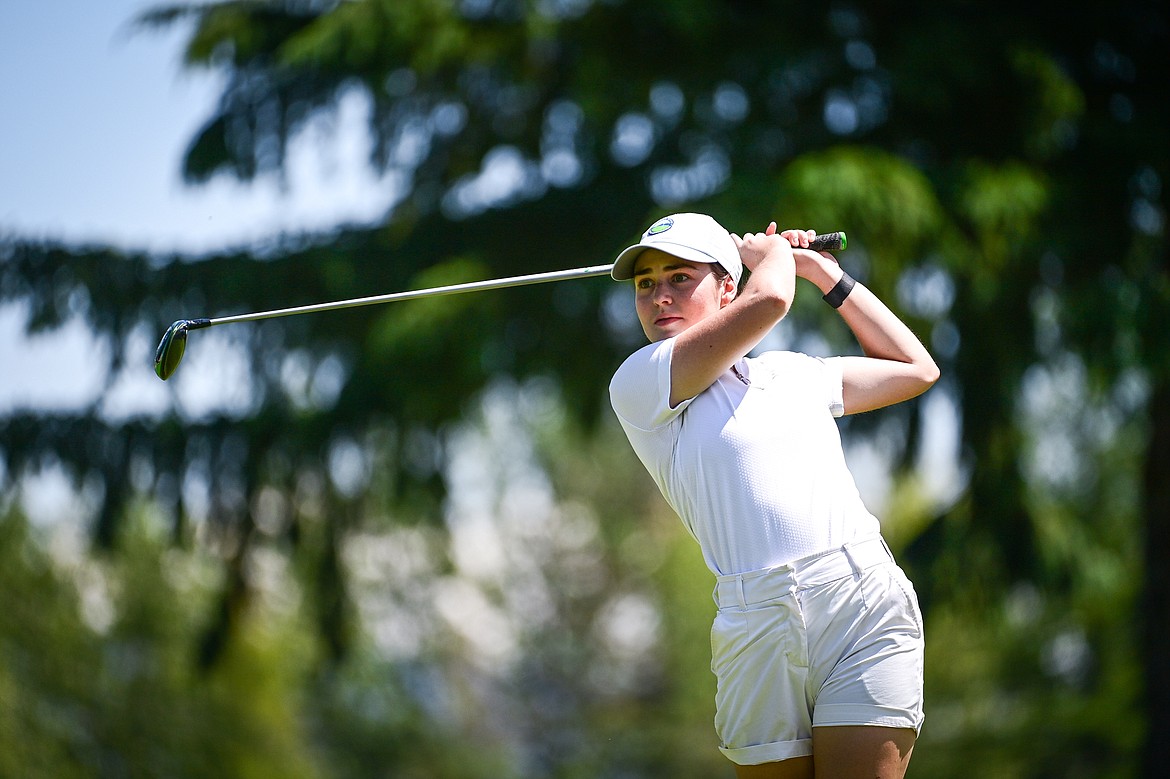 Tricia Joyce watches her tee shot on the 10th hole of the North Course during the Earl Hunt Memorial 4th of July Tournament at Whitefish Lake Golf Club on Friday, July 5. (Casey Kreider/Daily Inter Lake)