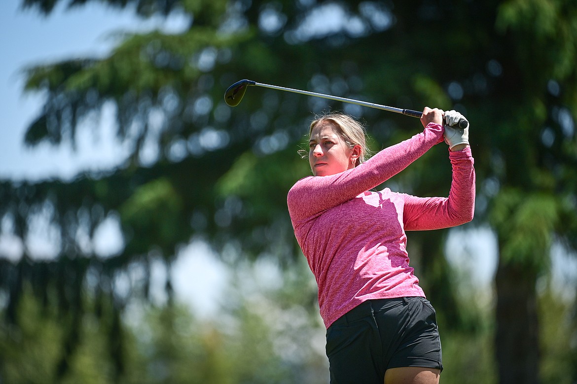 Raina Ports watches her tee shot on the 10th hole of the North Course during the Earl Hunt Memorial 4th of July Tournament at Whitefish Lake Golf Club on Friday, July 5. (Casey Kreider/Daily Inter Lake)