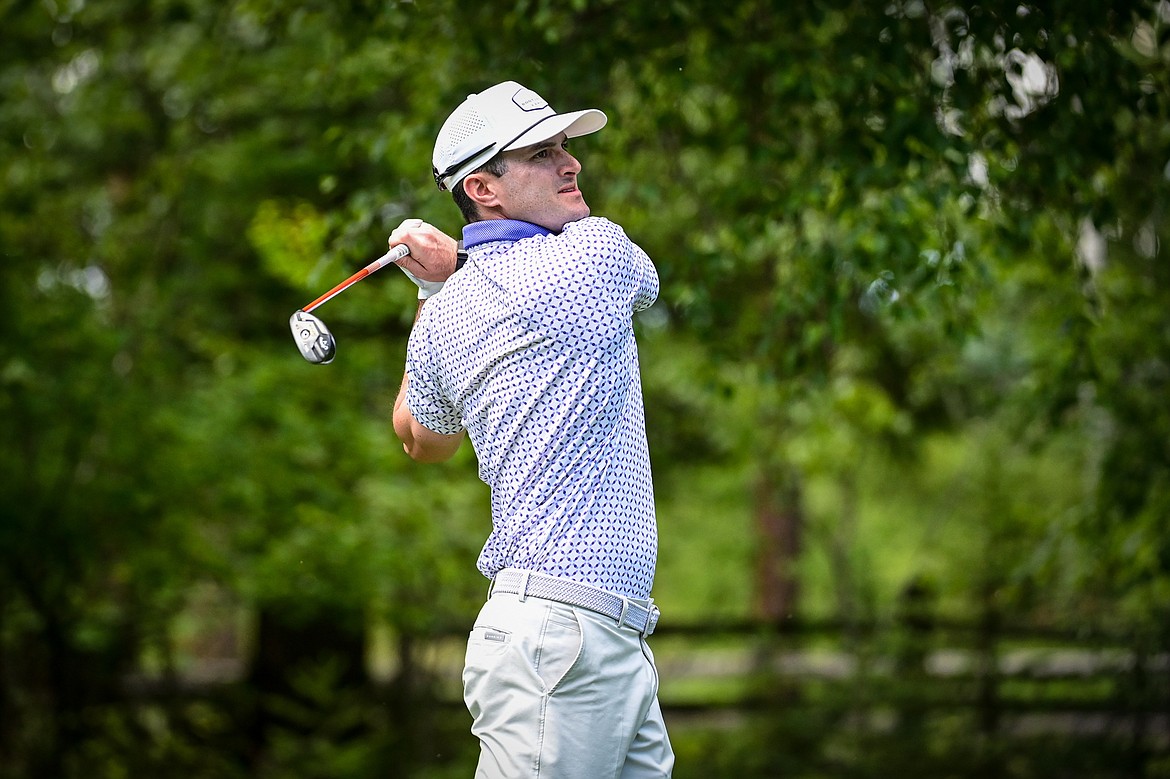 Cory Mehl watches his tee shot on the 10th hole of the South Course during the Earl Hunt Memorial 4th of July Tournament at Whitefish Lake Golf Club on Friday, July 5. (Casey Kreider/Daily Inter Lake)