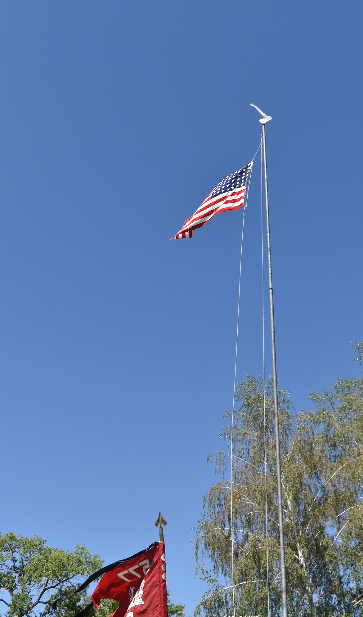 The U.S. flag flies proudly above the Patriotic Observance at George Thursday. The flag came from the casket of a deceased World War I veteran.