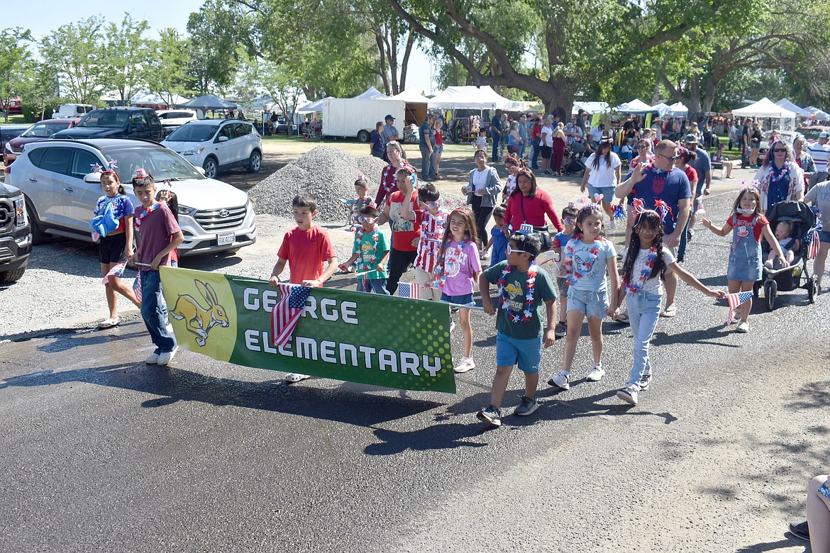 George Elementary School students march in the parade up and down Montmorency Boulevard in George Thursday.