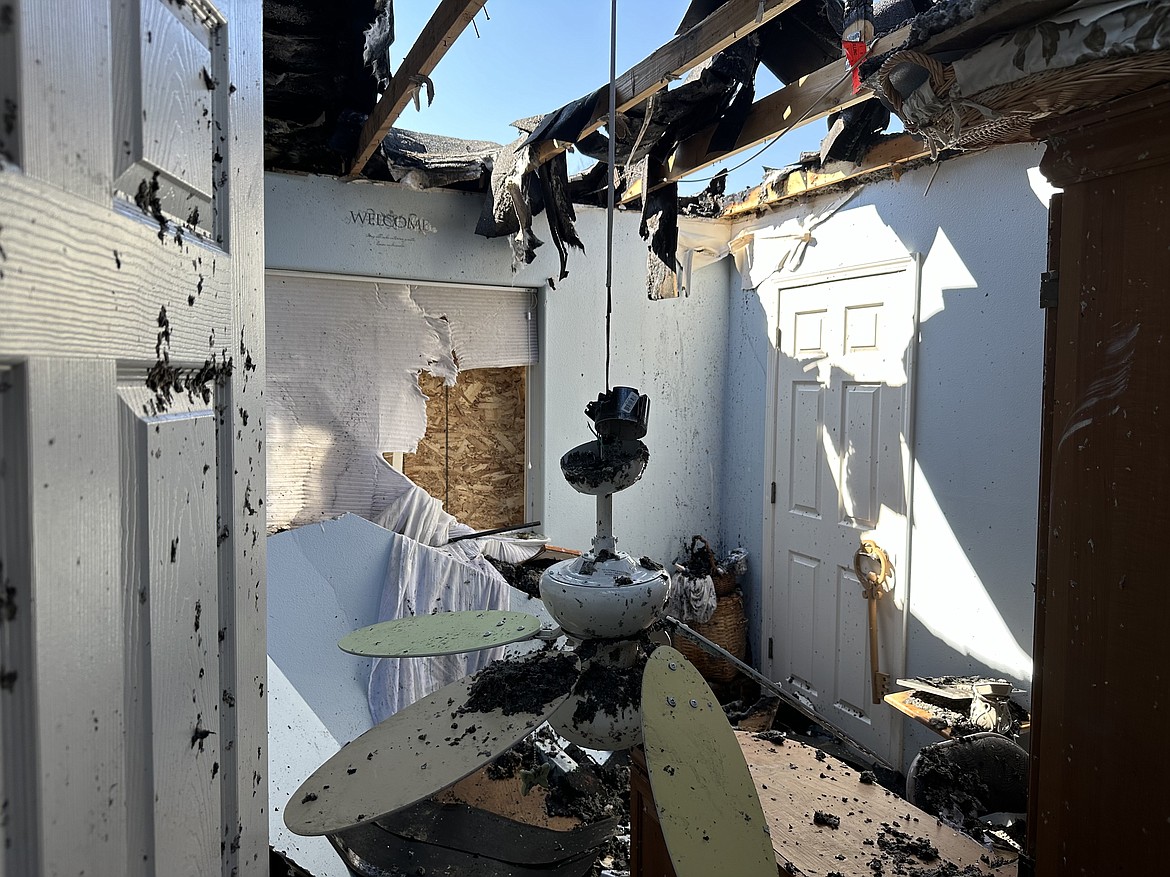 A photo shows the missing roof of a home after a fire in Hayden on the Fourth of July.