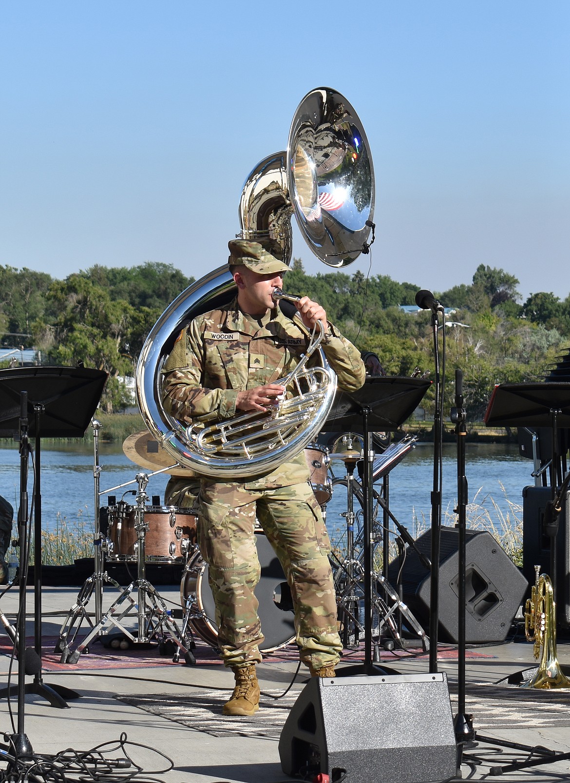 Sgt. Niko Woodin of the 133d Washington National Guard Band blows a solo tuba riff while warming up for the band’s performance at Moses Lake’s Red, White and Boom celebration Wednesday.