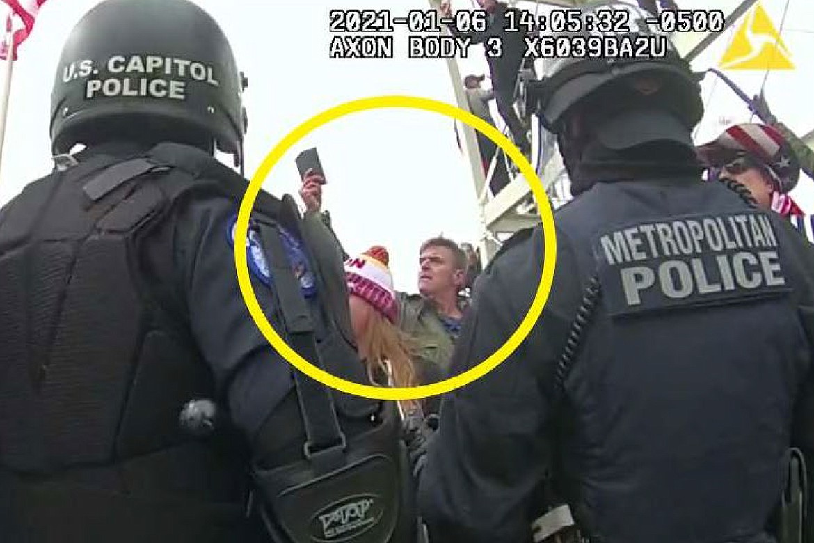 This image from Washington Metropolitan Police Department body-worn video, released and annotated by the Justice Department in the statement of facts supporting an arrest warrant for Jay James Johnston, shows Johnston, circled in yellow, at the U.S. Capitol on Jan. 6, 2021, in Washington. Johnston, an actor known for comedic roles in the movie “Anchorman” and the television series “Bob’s Burgers” has pleaded guilty to interfering with police officers trying to protect the U.S. Capitol from a mob’s attack. Johnston faces a maximum sentence of five years in prison after pleading guilty on Monday to a felony count of civil disorder. (Justice Department via AP, File)