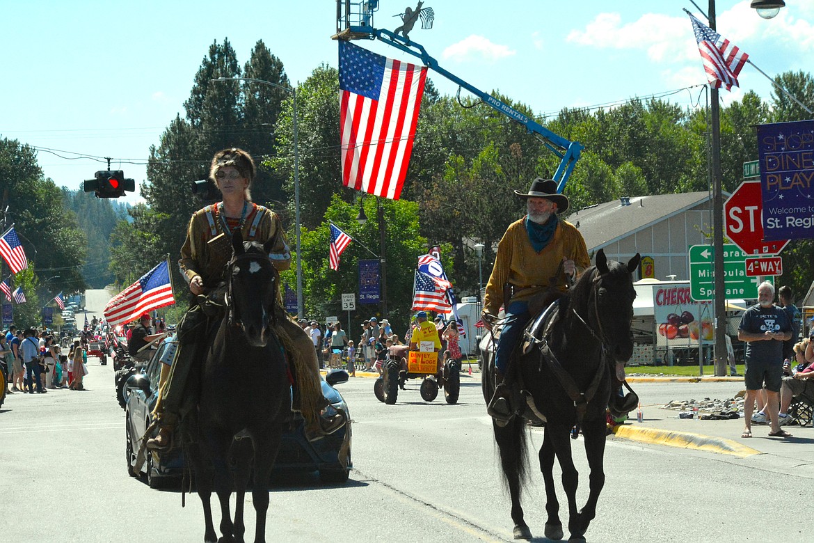 These frontiersmen look a bit lost on horseback during the Fourth of July parade. (Amy Quinlivan/Mineral Independent)