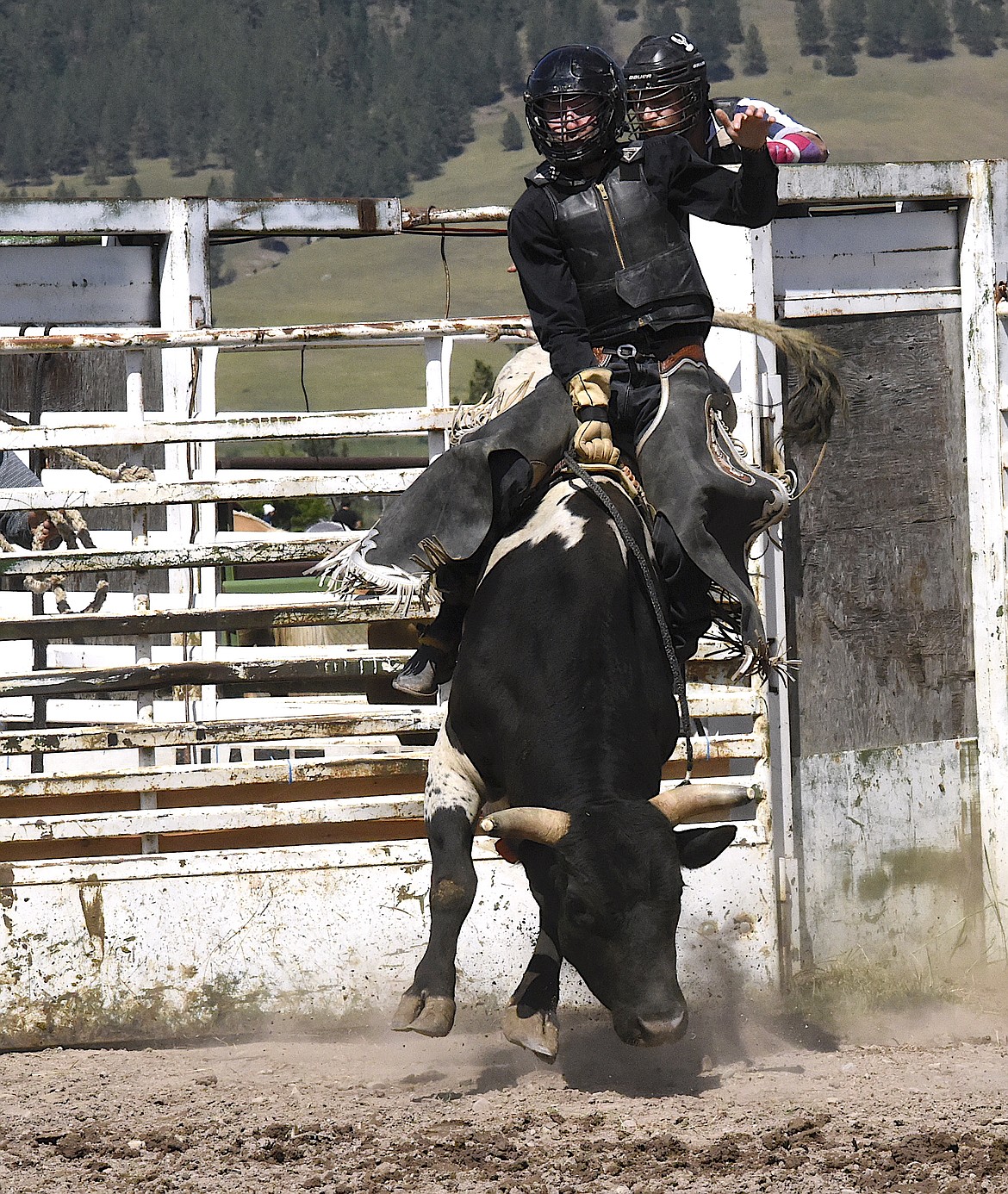 A bull rider starts a ride at the Arlee Open Rodeo on July 4. (Berl Tiskus/Leader)