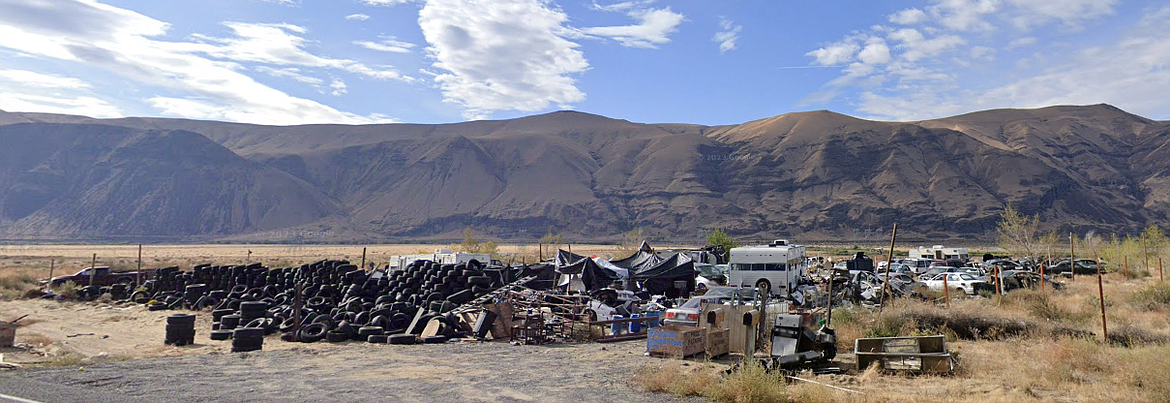 Grant County Commissioners have hired a contractor to clean up a derelict piece of property, pictured, south of Desert Aire.