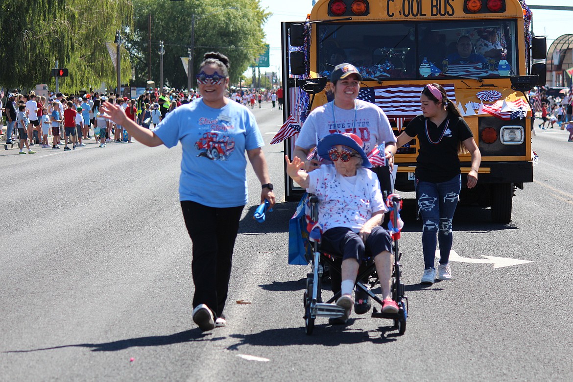 Staff and residents of Coventry House Assisted Living in Othello wave to the crowd during the July 4 parade.