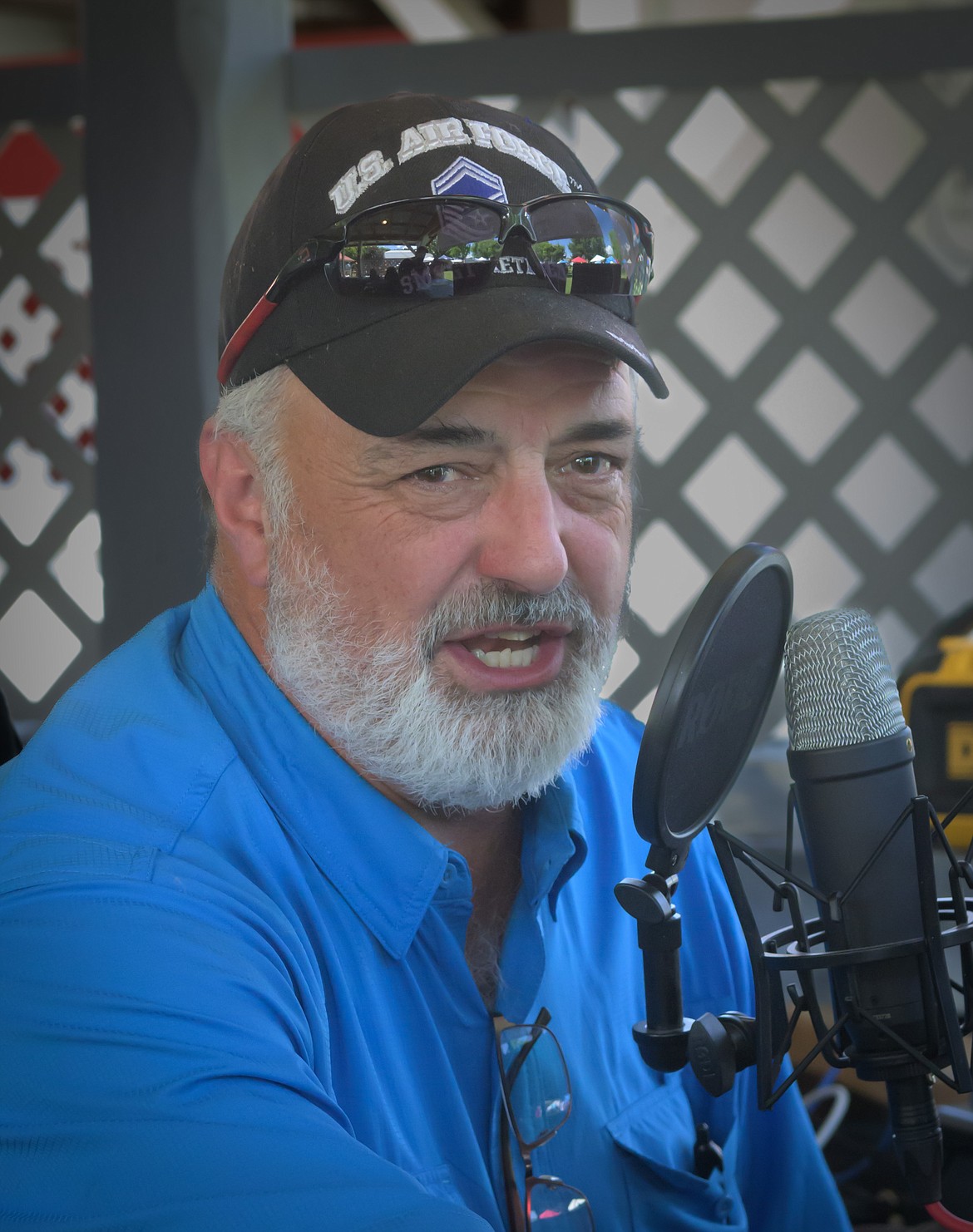 Owner of the new Clark Fork River Radio Raf Viniard talks during a live broadcast from the Fourth of July Freedom Festival in Plains. (Tracy Scott/Valley Press)