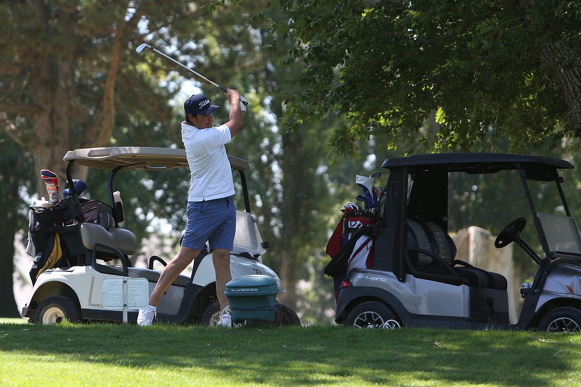 A golfer tees off at Saturday’s Othello Wrestling Club golf tournament at the Othello Golf Club.