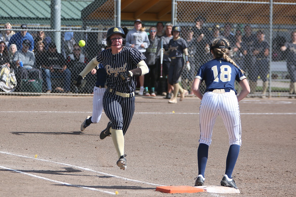 Royal junior Audrey Bergeson rushes to beat the ball thrown to first base during the 1A State Softball Tournament semifinals against Cedar Park Christian.