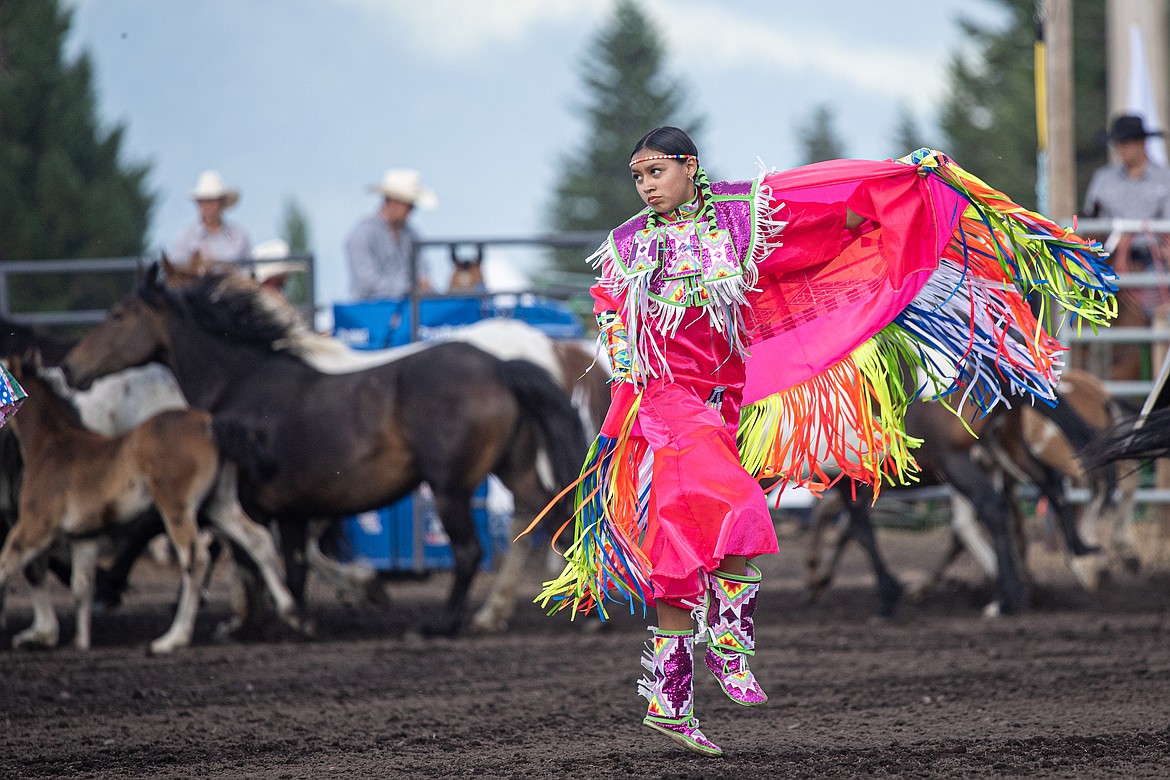 Blackfeet dancers welcome horses to the arena Friday during the opening processions. (Avery Howe/Bigfork Eagle)