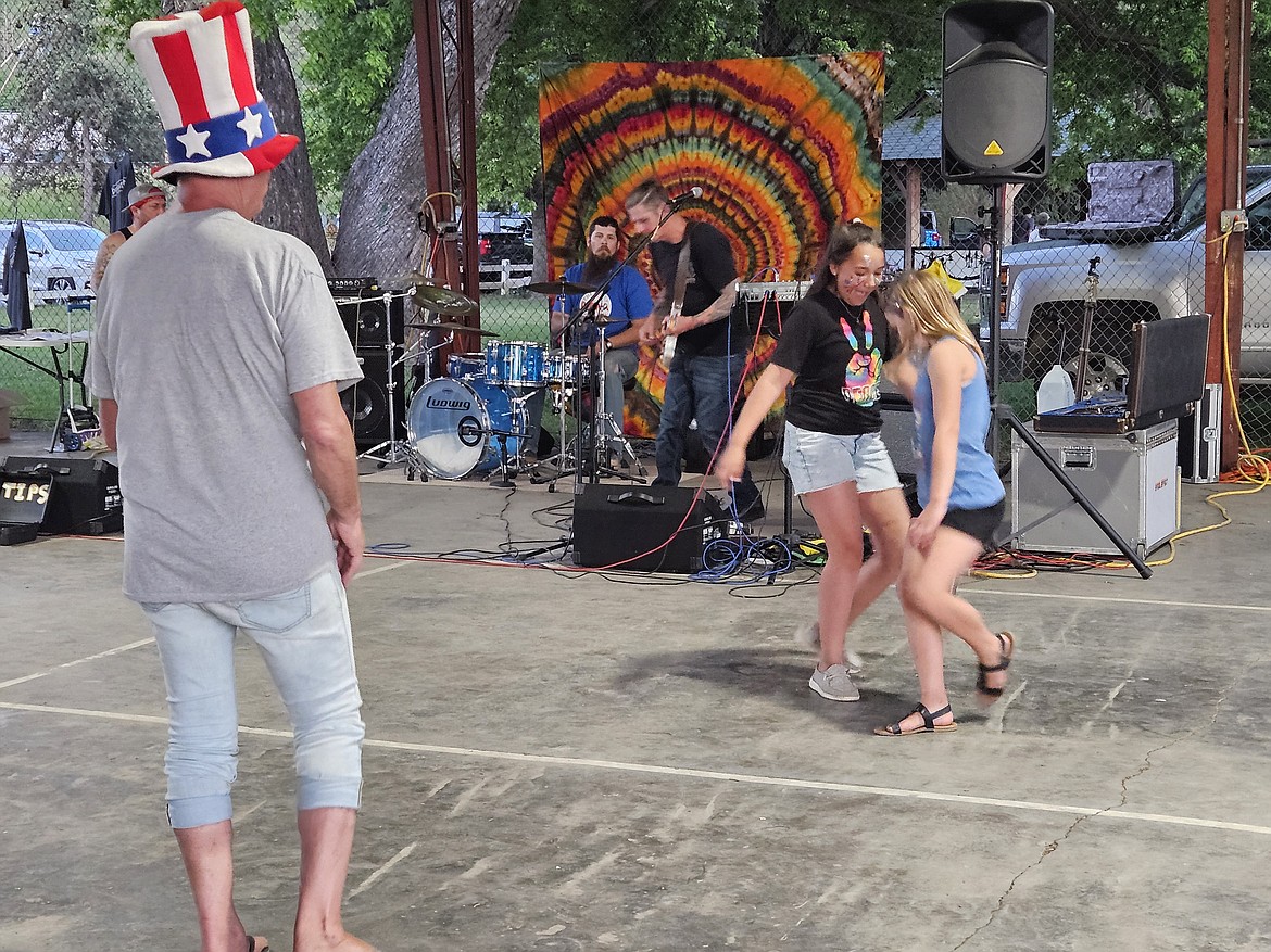 Young girls dancing to the music of Spool Effect at the Bonners Ferry Fourth of July celebration.