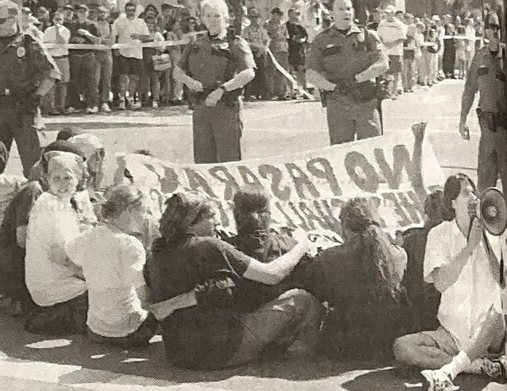 Protesters stage a sit-in at the Aryan Nations parade.