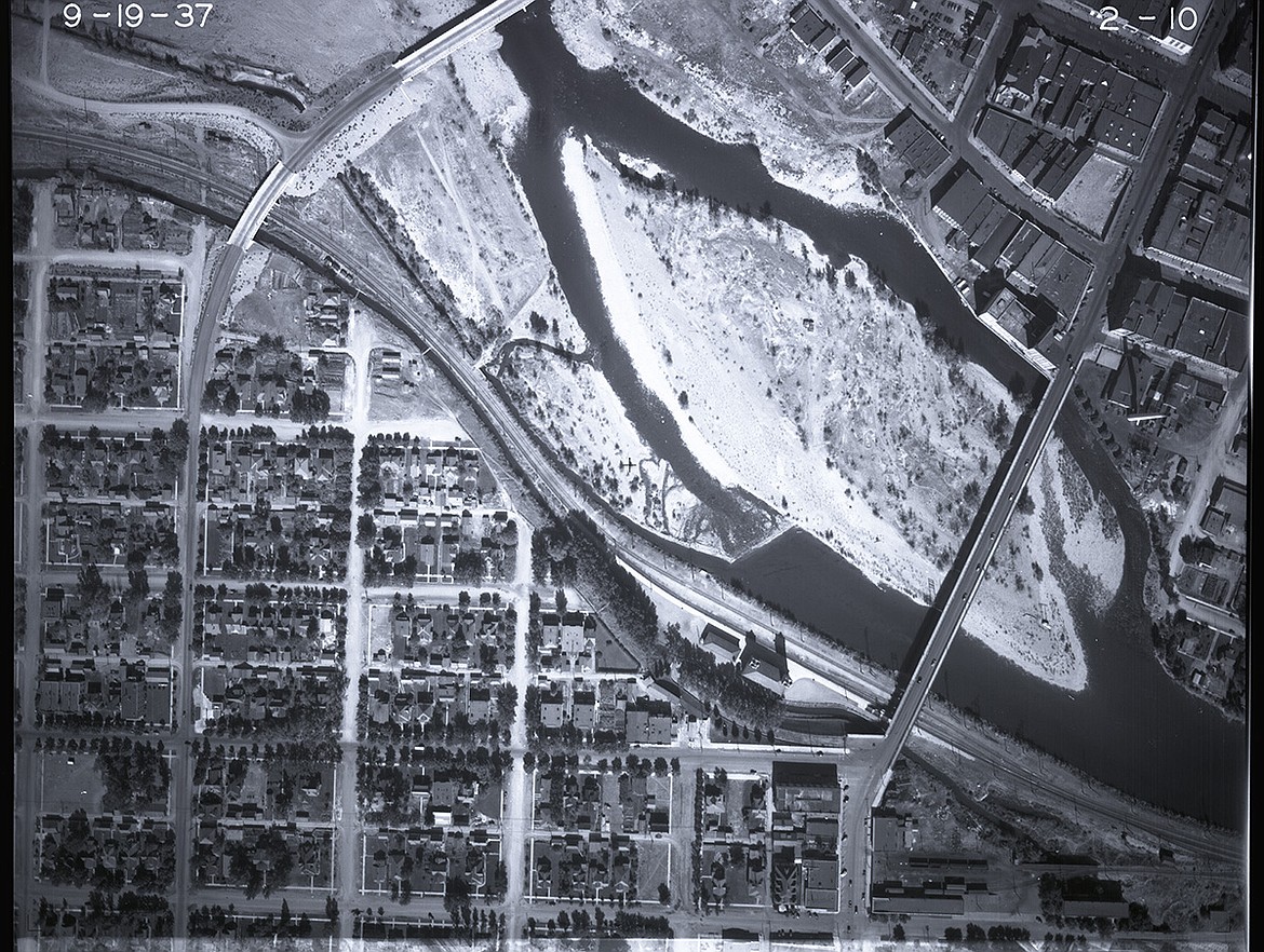 This 1937 image of Missoula shows an island in the Clark Fork River that today is Caras Park. (Photo courtesy UM News Service)