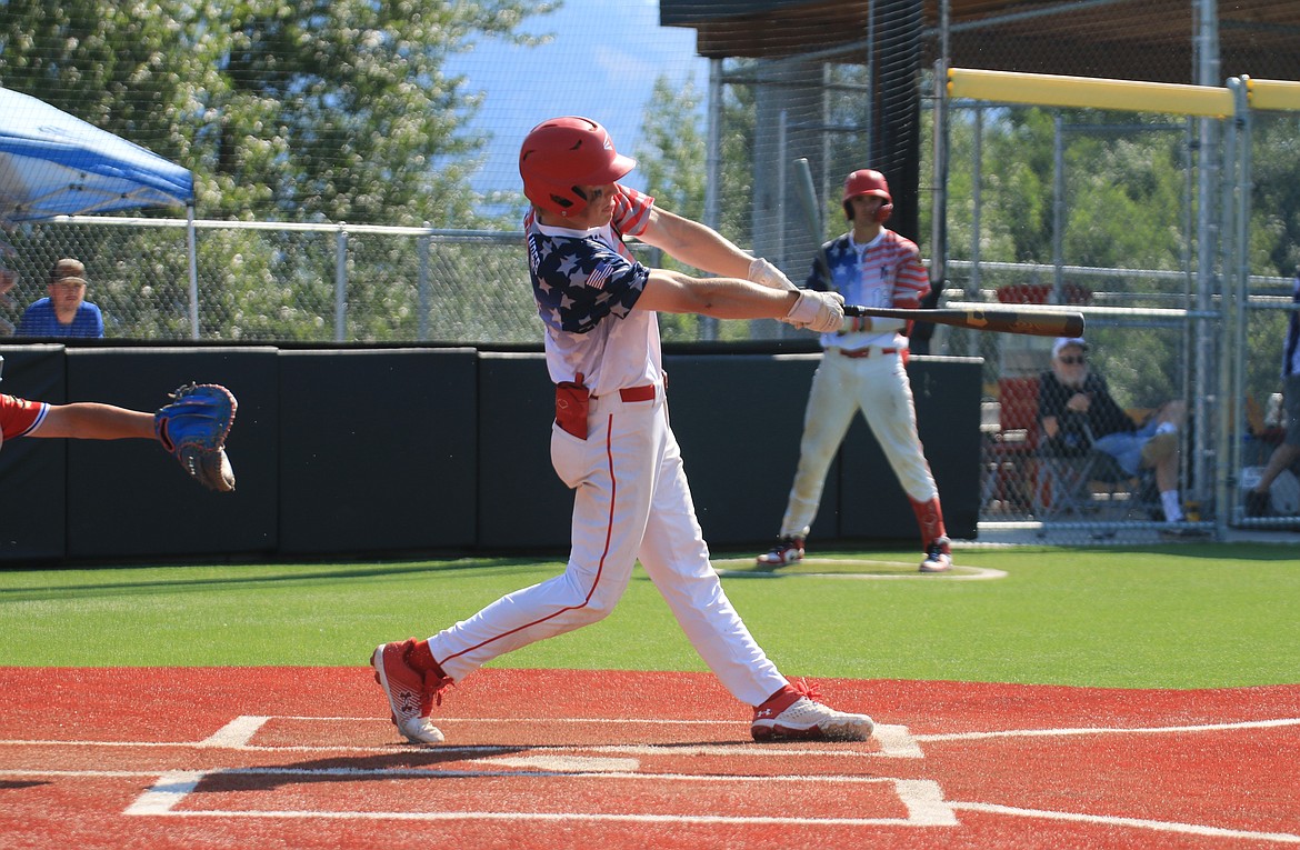 Finn Mellander rips a ball down the third base line for an RBI double during the second game against Orofino.