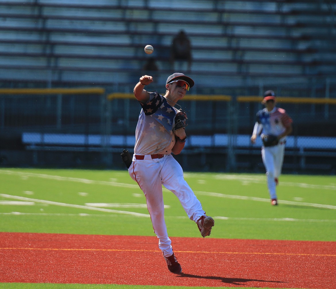 Shortstop Mason Little fields a ground ball and throws to first on the run during the second game against Orofino.