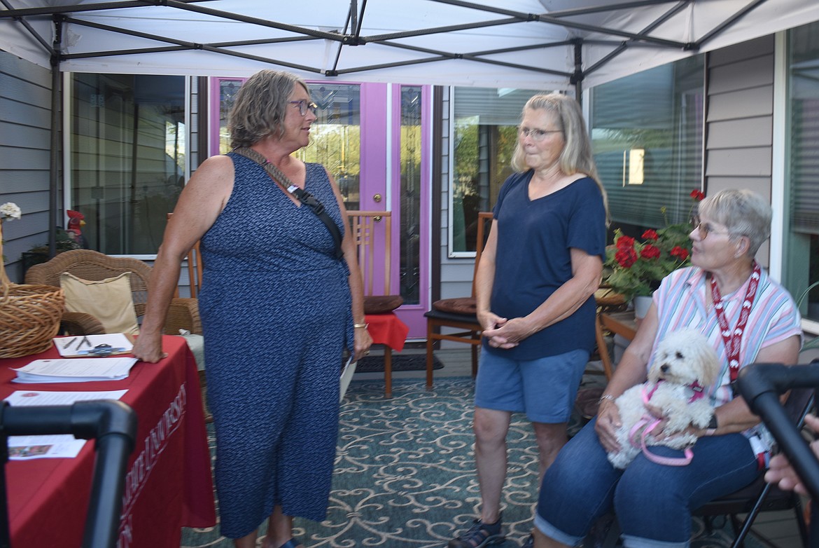 Amy Dinco, left, talks with WSU Master Gardeners Mary Love, middle, and Deb Russell at the Master Gardeners Garden Party Thursday in Moses Lake.