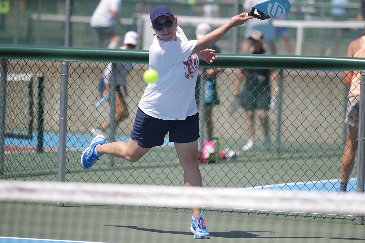 MARK NELKE/Press
Amy Edwards of Spokane watches her slice serve Friday at the Coeur d'Alene Classic pickleball tournament at the Cherry Hill Park in Coeur d'Alene. Edwards teamed with Robyn Nance of Spokane to win the gold medal match in the women's doubles 3.0 age 50-55 division, beating Christy Daurie of Okotoks, Alberta, and Pam Olive of Chestermere, Alberta.