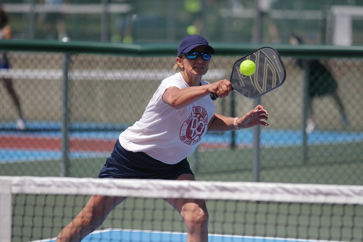 MARK NELKE/Press
Robyn Nance of Spokane hits a backhand volley during the Coeur d'Alene Classic pickleball tournament Friday at Cherry Hill Park in Coeur d'Alene. Nance, taking the day off from her anchor role on KXLY's "Good Morning Northwest," teamed with Amy Edwards of Spokane to win the gold medal match in the women's doubles 3.0 age 50-55 division.