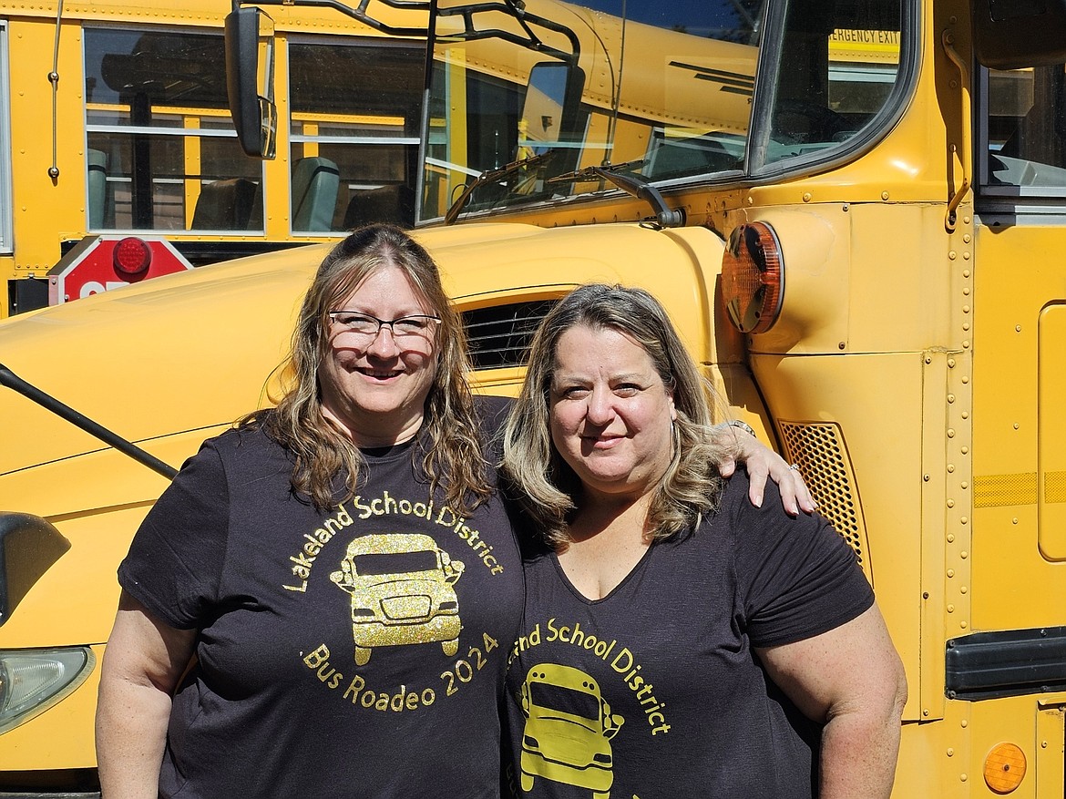 Becky Craig-Johnson and Shawna King of Lakeland School District, hug after placing first and second in regional bus safety competition. Both qualified for the Idaho state school bus safety competition in Boise in June.