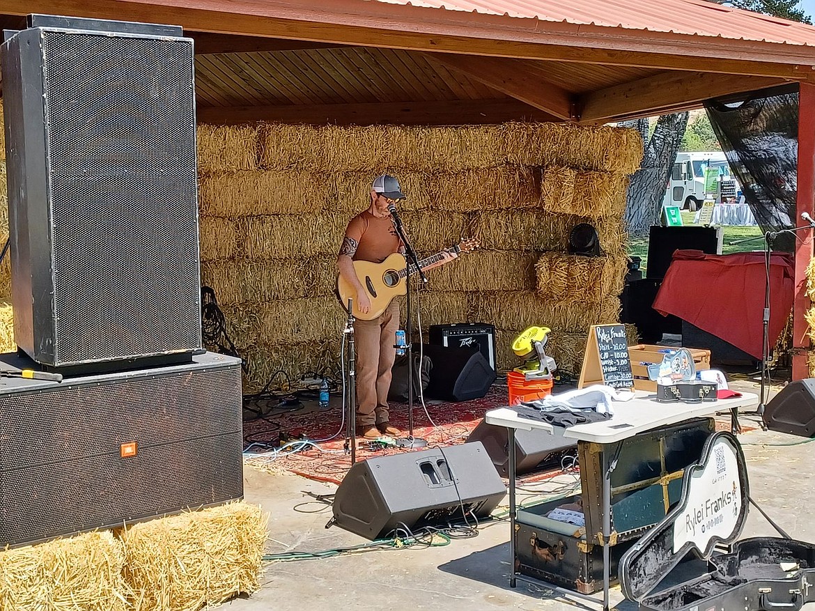 Rylei Franks playing his set Saturday at Smokiam Park in Soap Lake during the Folk and Food Festival. The event included live music and a variety of vendors.