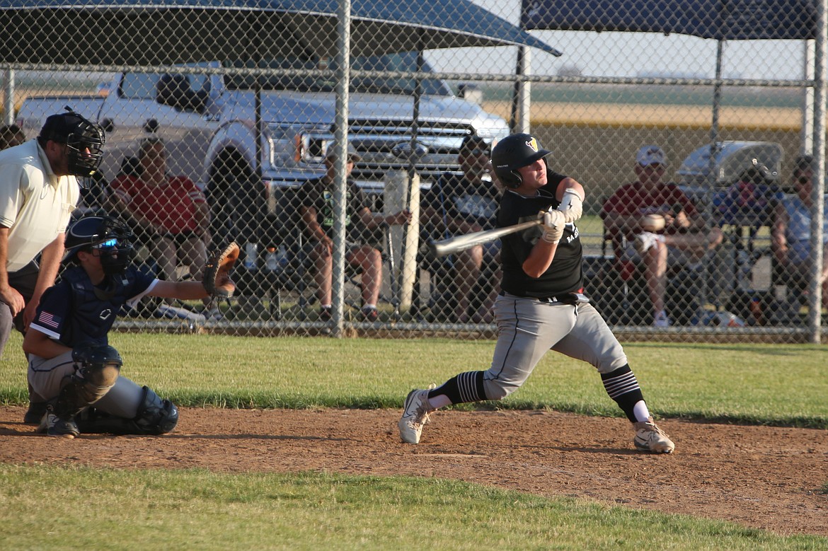 Almira/Coulee-Hartline Legion catcher Kaysen Pryor, right, delivers a two-RBI single in the top of the second inning against Gonzaga Prep AA on Friday evening in Hartline. Pryor had a team-high four RBI in the nightcap of Friday’s doubleheader.