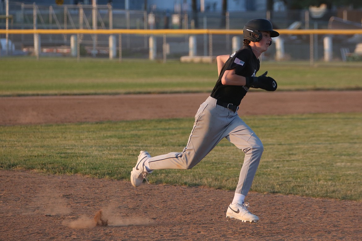 Legion baserunner Karson Thompson rounds third base before scoring on an error by Gonzaga Prep AA.