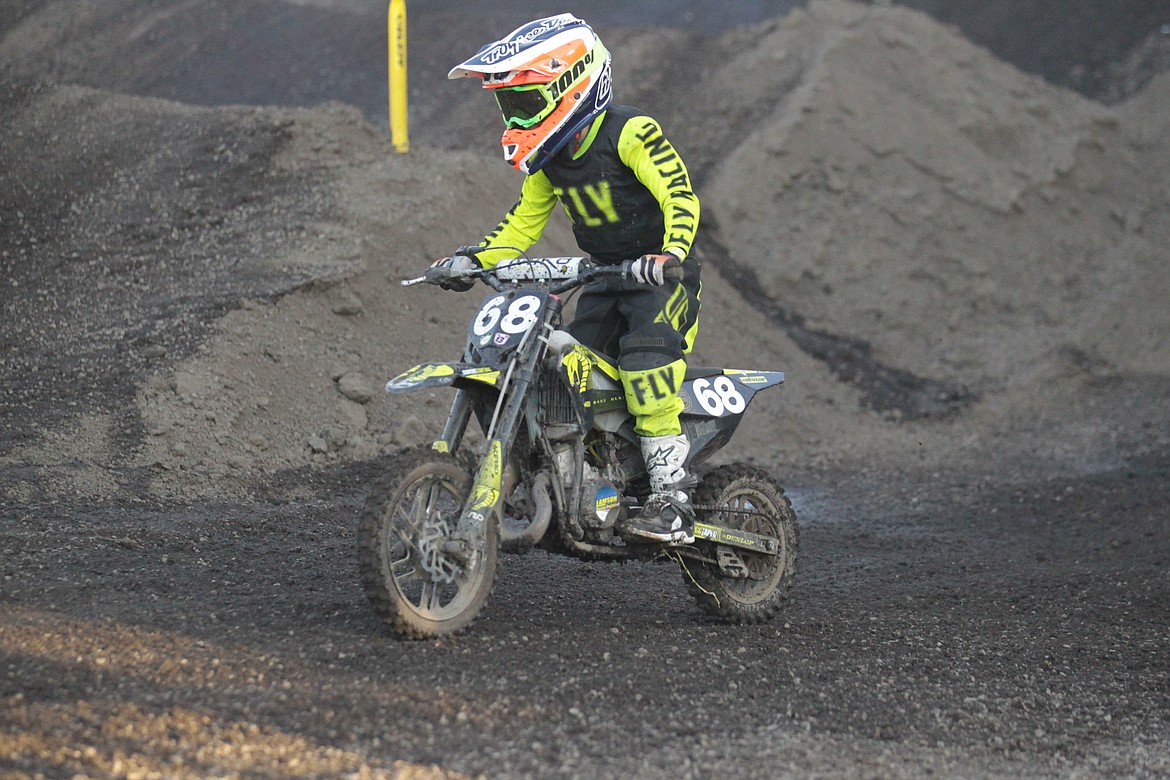 JASON ELLIOTT/Press
Coeur d'Alene's Aiden Henkel flies around the track during the first heat of the Peewee 50CC class (ages 7-8) at Saturday's Arenacross event at the Kootenai County Fairgrounds.