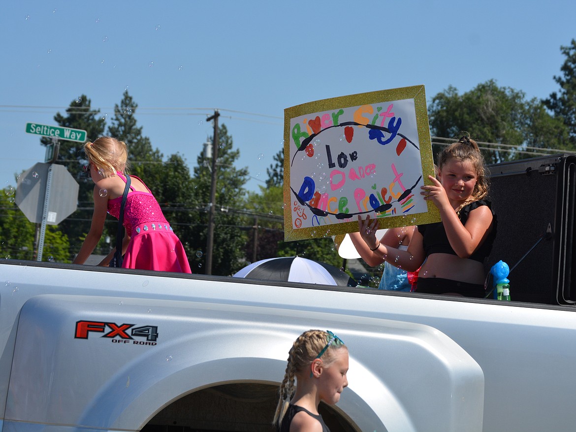 River City Dance Project cruises through the crowds as bubbles fill the air during the Post Falls parade.