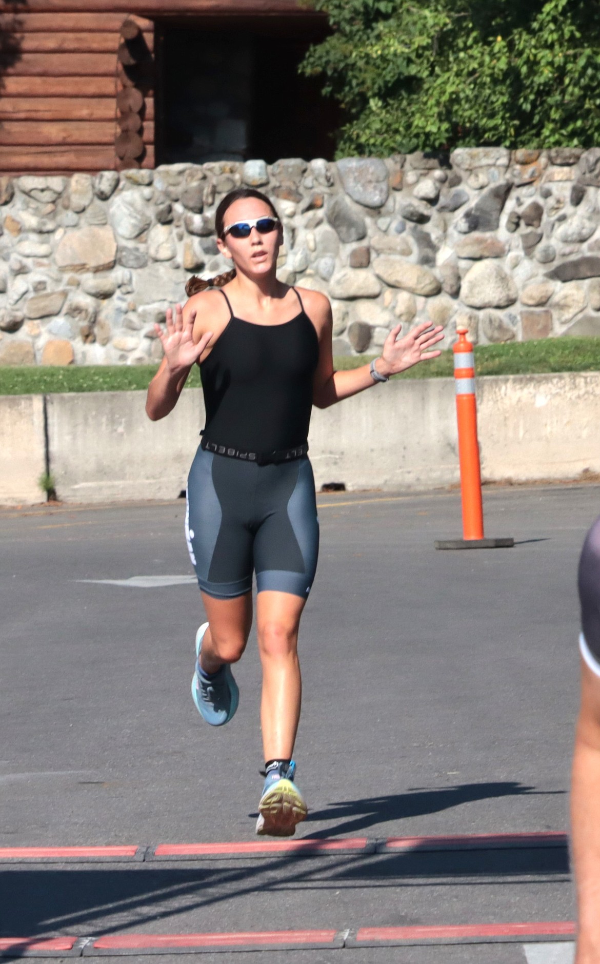 Kaylynn Misner of Post Falls crosses the finish line of the Hayden Triathlon on Saturday in first place for the women.