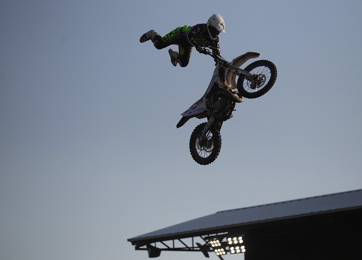 JASON ELLIOTT/Press
Michael McCoy of Spokane performs a front flip during the opening ceremonies of Saturday's Arenacross event at the Kootenai County Fairgrounds.