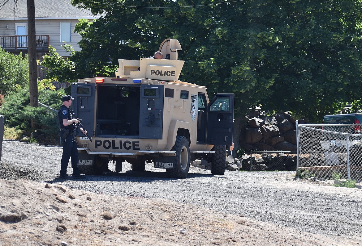 Moses Lake Police officers work to remove a barricaded subject in June 2023. Moses Lake and Ephrata both saw their crime rates trending down between 2022 and 2023.