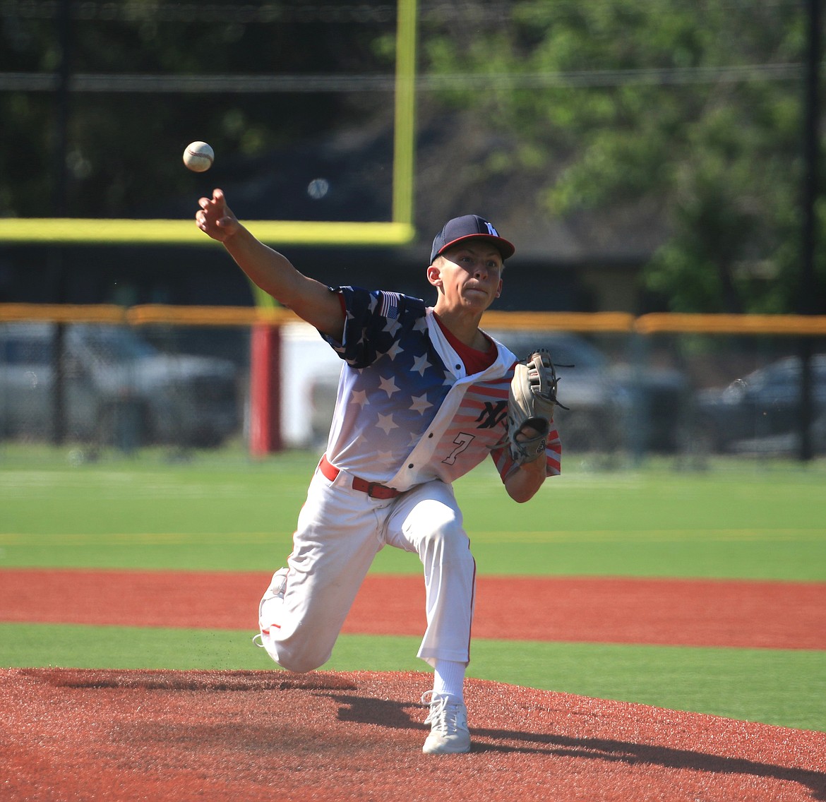 Parker Reichart throws a fastball during the first game against Camas Prairie. Reichart, who got the start in the contest, went three innings and gave up four hits and three earned runs while striking out two batters.