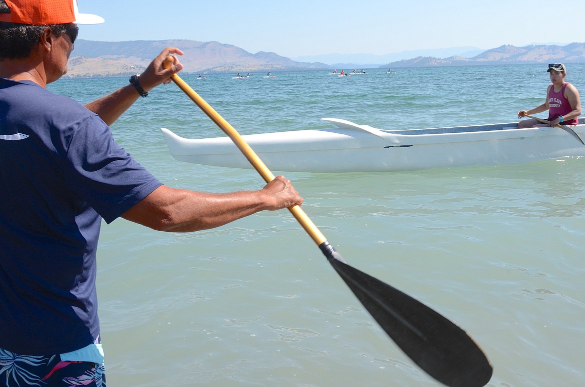 One of Tahiti’s most celebrated athletes, Coach Lewis Laughlin, instructed an outrigger canoe clinic in Big Arm Sunday morning. He also carried the the Olympic Torch during the 31st stage of this ceremonial relay that concludes in Paris. (Kristi Niemeyer/Leader)