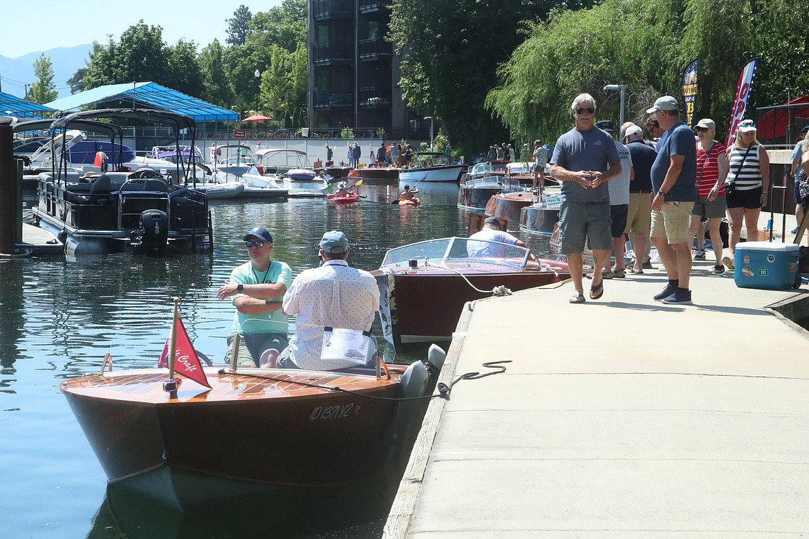 Alan Thompson and Alan Wardswoth sit aboard Thompson's boat as they take part in the annual Sandpoint Antique & Classic Boat Show held this weekend at the Sandpoint Marina and boardwalk.