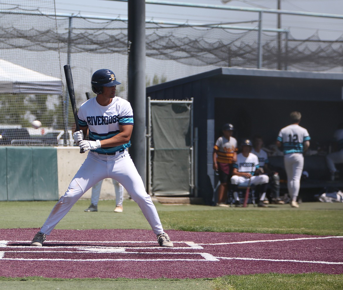 River Dog designated hitter Jett Lewallen waits for a pitch in the batter’s box against Pullman on Sunday. Lewallen hit a three-run home run in the championship game against Penticton Sunday afternoon.