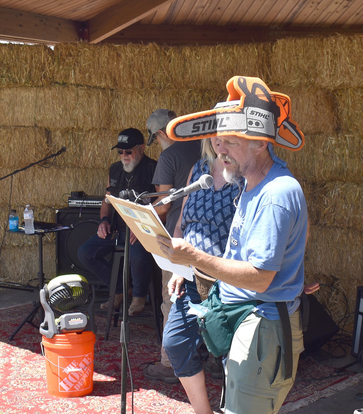 Wendell Tobiason reads out the winning number in a raffle drawing at the Soap Lake Food and Folk Festival Saturday. Local businesses donated prizes for the raffles, which organizer Kim Anderson said were hugely successful.