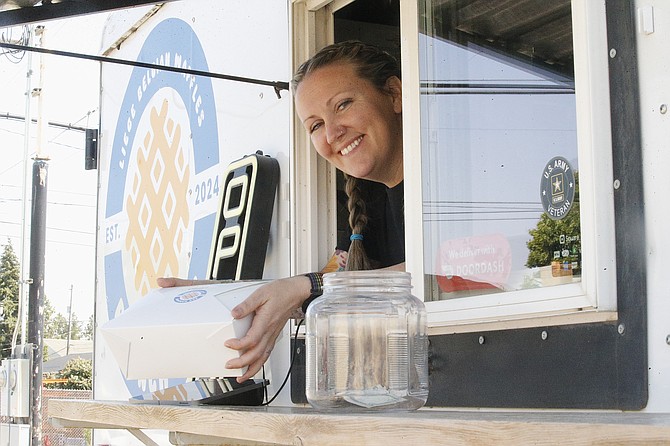 Karissa Hubiak serves up an order at Brunch Box.